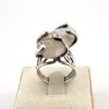Vintage Modernist Brutalist sterling silver studio ring with a large tumbled amethyst pebble and hand wrought scroll setting.