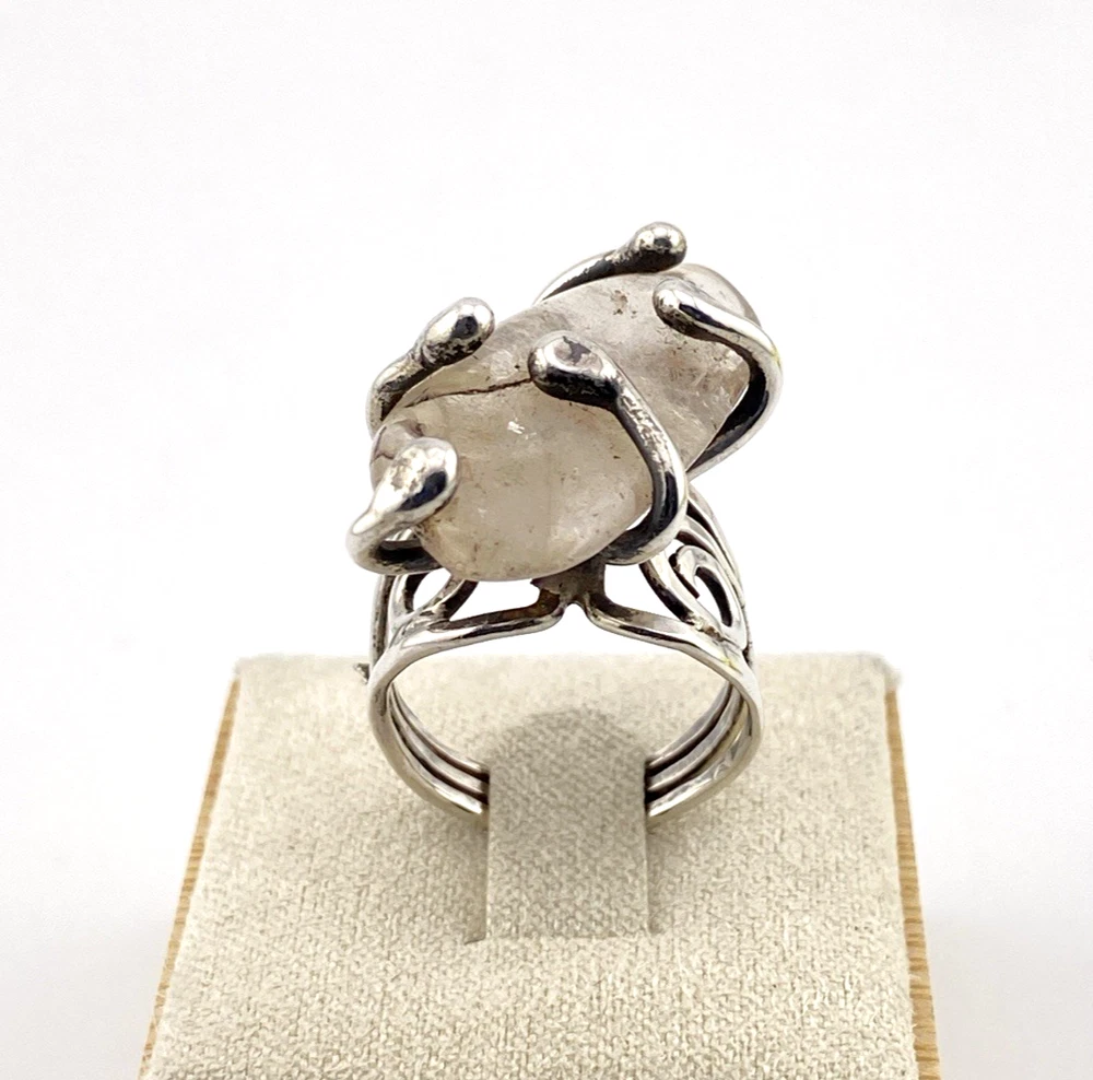 Vintage Modernist Brutalist sterling silver studio ring with a large tumbled amethyst pebble and hand wrought scroll setting.