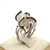 Vintage Modernist Brutalist sterling silver studio ring with a large tumbled amethyst pebble and hand wrought scroll setting.