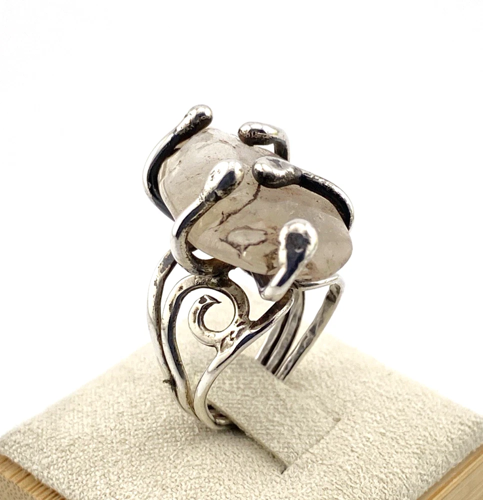 Vintage Modernist Brutalist sterling silver studio ring with a large tumbled amethyst pebble and hand wrought scroll setting.