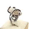 Vintage Modernist Brutalist sterling silver studio ring with a large tumbled amethyst pebble and hand wrought scroll setting.