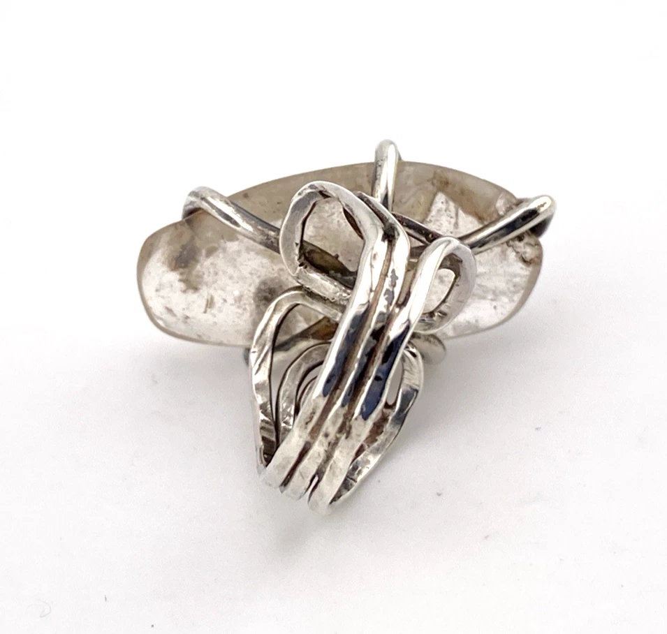 Vintage Modernist Brutalist sterling silver studio ring with a large tumbled amethyst pebble and hand wrought scroll setting.