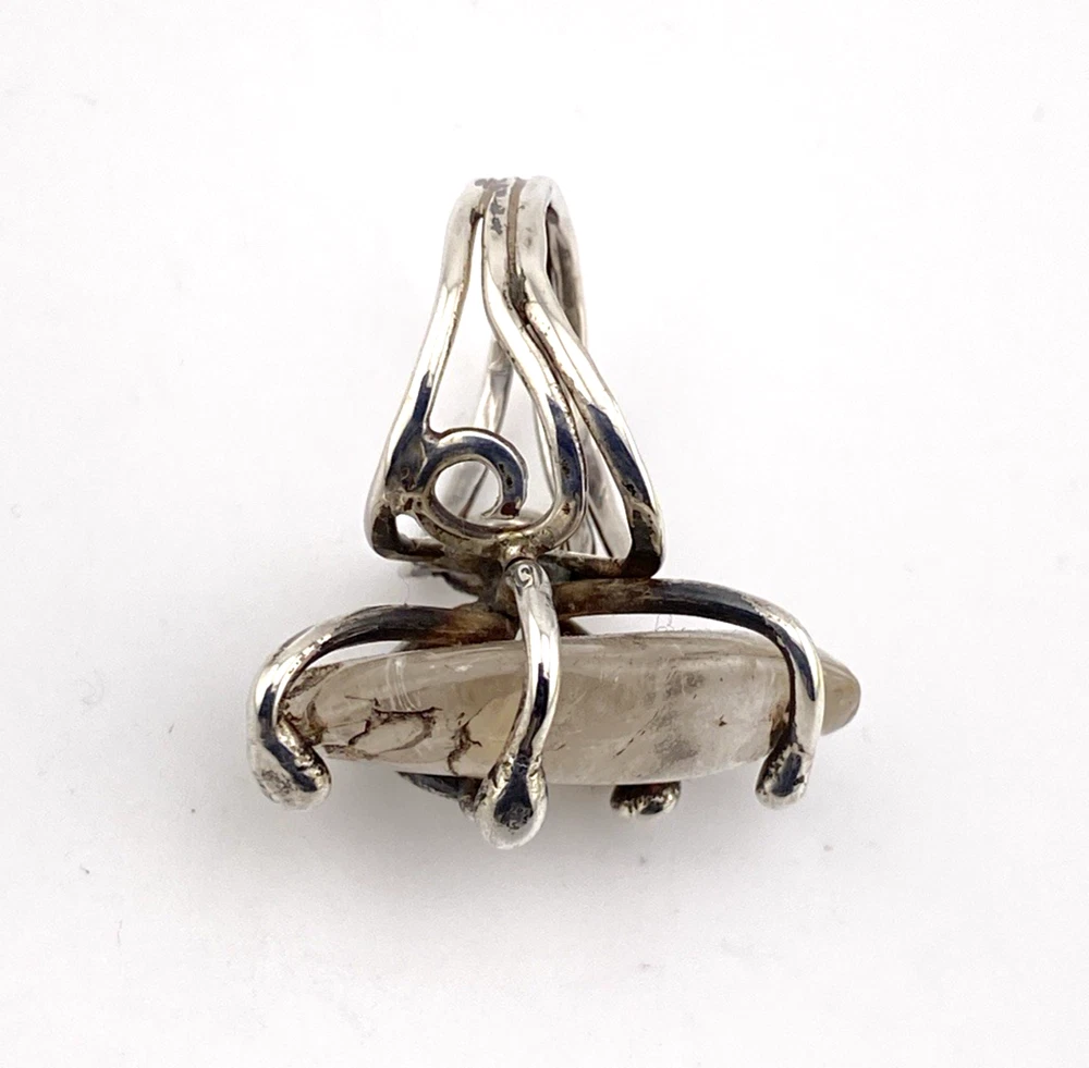 Vintage Modernist Brutalist sterling silver studio ring with a large tumbled amethyst pebble and hand wrought scroll setting.