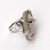 Vintage Modernist Brutalist sterling silver studio ring with a large tumbled amethyst pebble and hand wrought scroll setting.