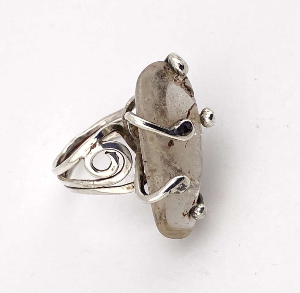Vintage Modernist Brutalist sterling silver studio ring with a large tumbled amethyst pebble and hand wrought scroll setting.