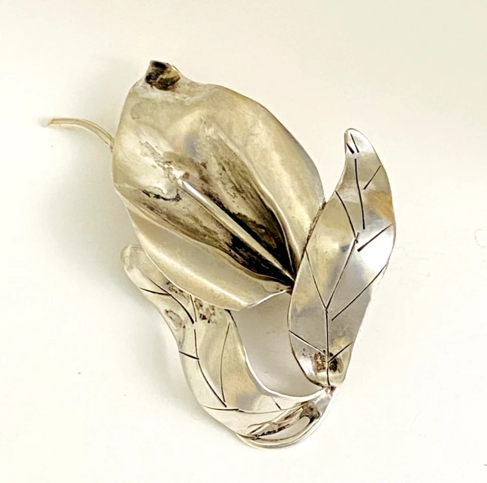 Vintage Modernist sterling silver calla lily brooch signed PA Reg with dimensional handmade leaves and heavy patina.