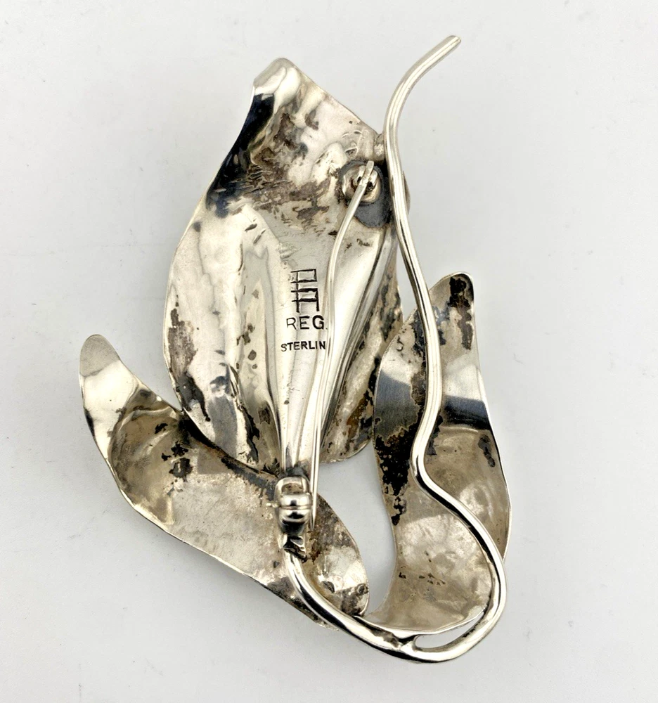Vintage Modernist sterling silver calla lily brooch signed PA Reg with dimensional handmade leaves and heavy patina.