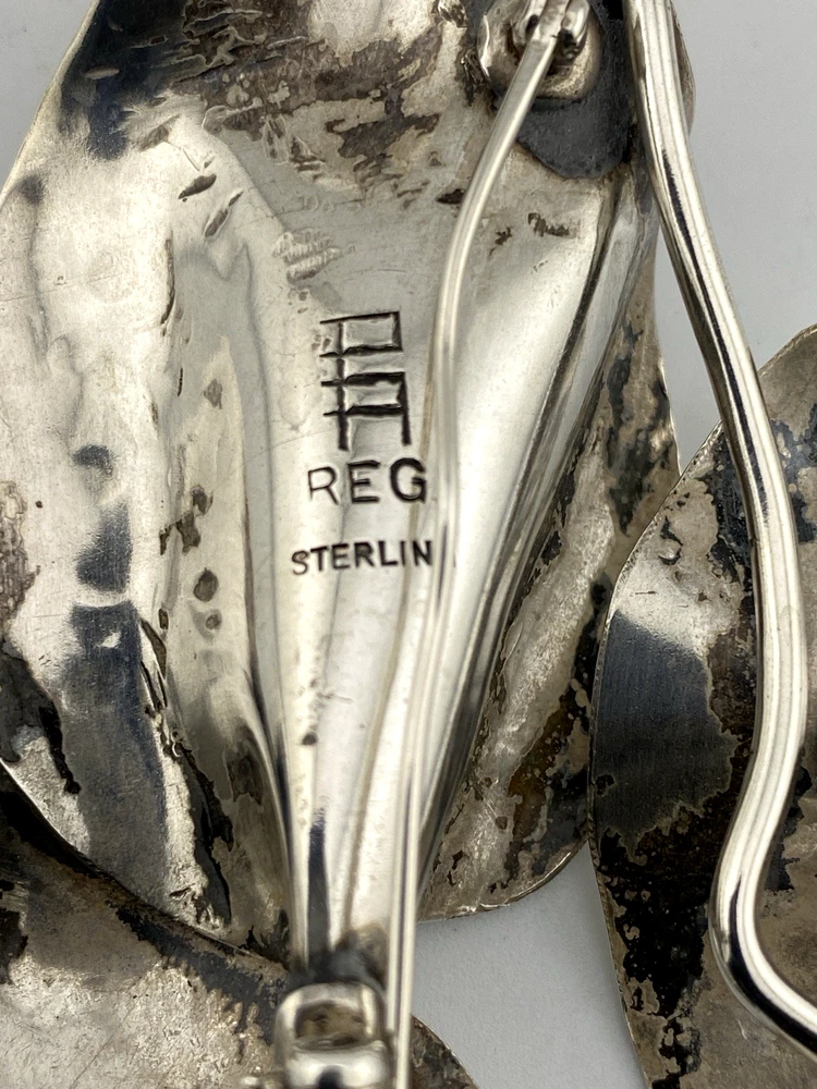 Vintage Modernist sterling silver calla lily brooch signed PA Reg with dimensional handmade leaves and heavy patina.
