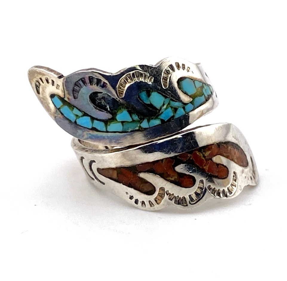 Signed Ahasteen Navajo sterling silver bypass ring with turquoise and coral inlay feather design.

8. Short Description