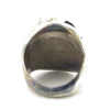 Vintage old pawn style sterling silver ring with turquoise and coral cabochons, raised silver details, and dark patina.