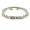 Vintage sterling silver octagonal hinged bangle bracelet with engraved details and safety chain.
