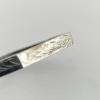 Vintage sterling silver octagonal hinged bangle bracelet with engraved details and safety chain.
