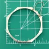 Vintage sterling silver octagonal hinged bangle bracelet with engraved details and safety chain.
