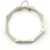 Vintage sterling silver octagonal hinged bangle bracelet with engraved details and safety chain.