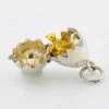 Vintage sterling silver hinged egg pendant charm that opens to reveal a gold vermeil chick inside.