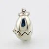 Vintage sterling silver hinged egg pendant charm that opens to reveal a gold vermeil chick inside.
