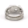 Vintage Uncas men’s Modernist white gold plated ring with open shoulders and a round faceted crystal.