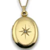 Vintage Winard 1/20 12K gold filled oval locket necklace with diamond accent, chased eight point starburst, and 17 inch curb chain