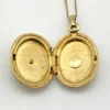 Vintage Winard 1/20 12K gold filled oval locket necklace with diamond accent, chased eight point starburst, and 17 inch curb chain
