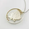 Hand cut Peace Dollar silver coin pendant detail