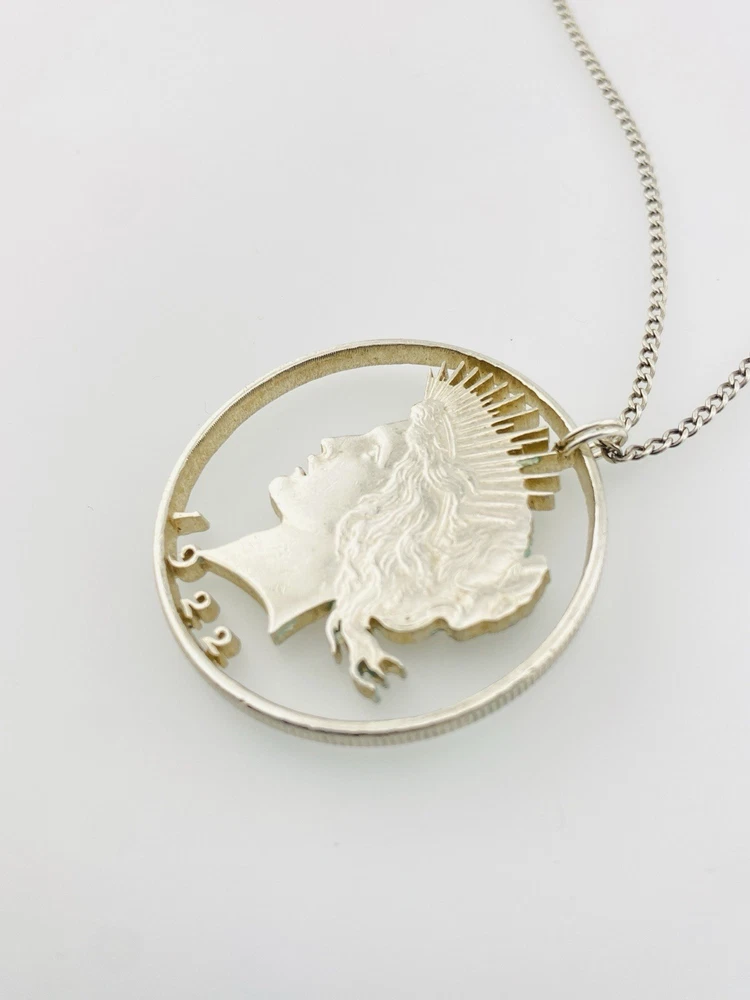 Hand cut Peace Dollar silver coin pendant detail