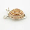 Sterling silver figural snail pendant with natural spiral shell and dimensional artisan design