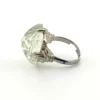 Art Deco clear cut glass sugarloaf cocktail ring with etched sunrise pattern in silver tone setting