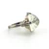 Art Deco clear cut glass sugarloaf cocktail ring with etched sunrise pattern in silver tone setting