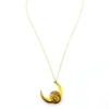 Antique Victorian crescent moon brooch converted into a pendant necklace with a faceted glass stone, enamel accents, and an 18¼-inch gold filled chain.