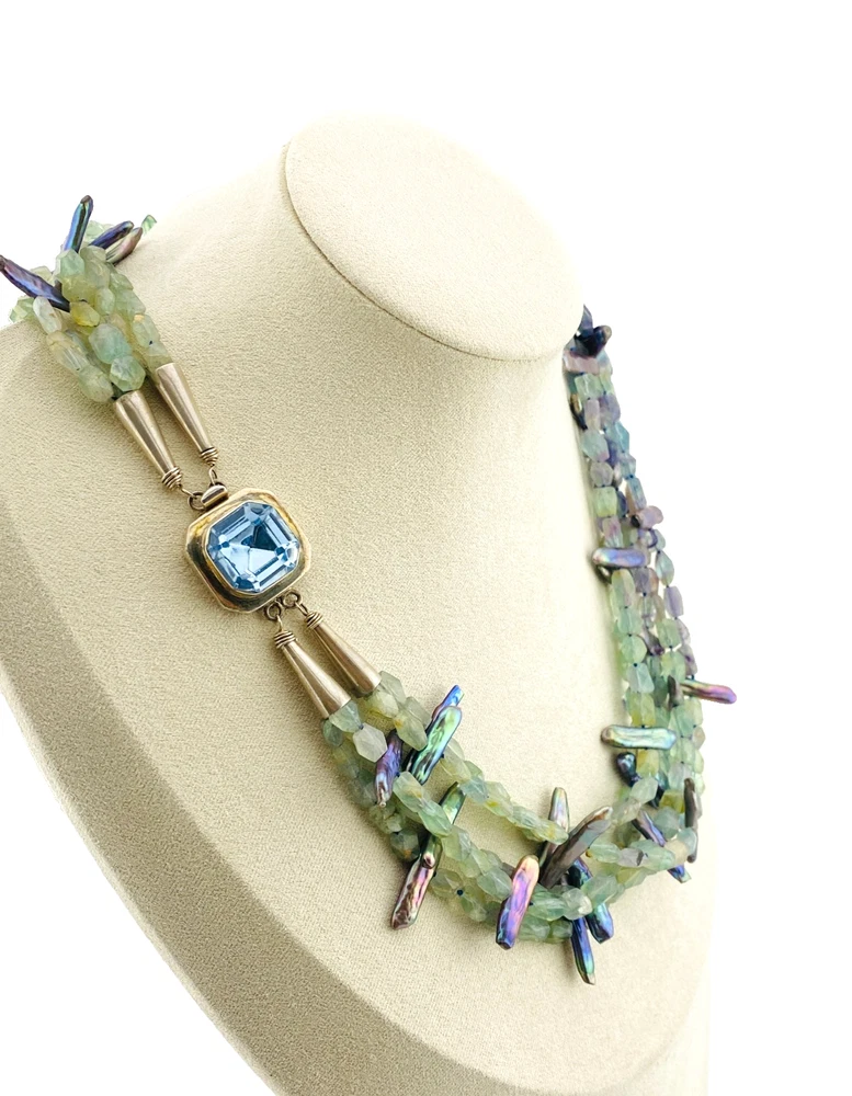 Five-strand necklace of green fluorite and iridescent peacock stick pearls with a square sterling silver clasp