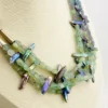 Five-strand necklace of green fluorite and iridescent peacock stick pearls with a square sterling silver clasp