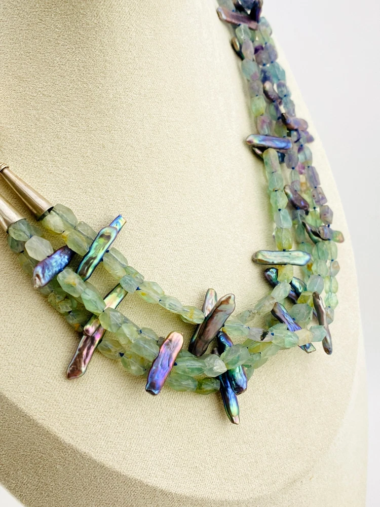 Five-strand necklace of green fluorite and iridescent peacock stick pearls with a square sterling silver clasp