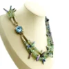 Five-strand necklace of green fluorite and iridescent peacock stick pearls with a square sterling silver clasp