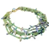 Five-strand necklace of green fluorite and iridescent peacock stick pearls with a square sterling silver clasp