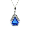 Art Deco shield-form lavalier necklace with cornflower-blue glass and clear paste stones