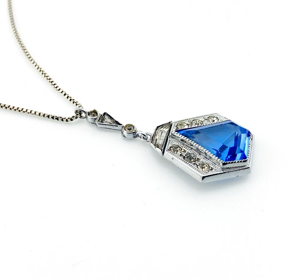Art Deco shield-form lavalier necklace with cornflower-blue glass and clear paste stones