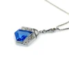 Art Deco shield-form lavalier necklace with cornflower-blue glass and clear paste stones