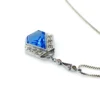 Art Deco shield-form lavalier necklace with cornflower-blue glass and clear paste stones