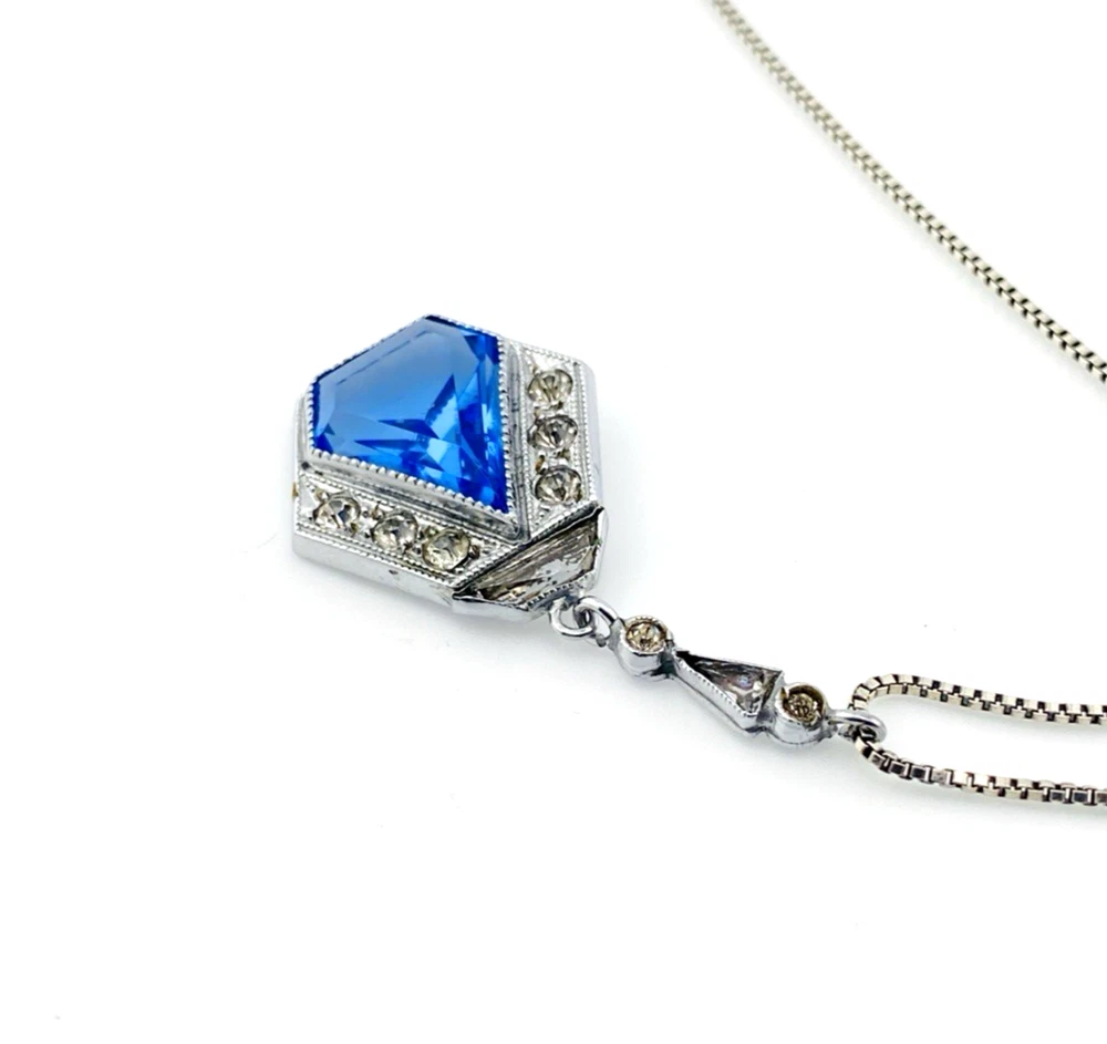 Art Deco shield-form lavalier necklace with cornflower-blue glass and clear paste stones
