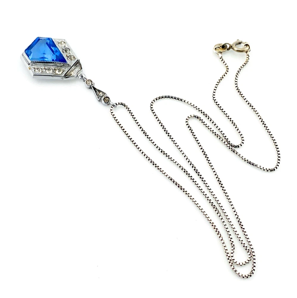 Art Deco shield-form lavalier necklace with cornflower-blue glass and clear paste stones