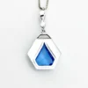 Art Deco shield-form lavalier necklace with cornflower-blue glass and clear paste stones