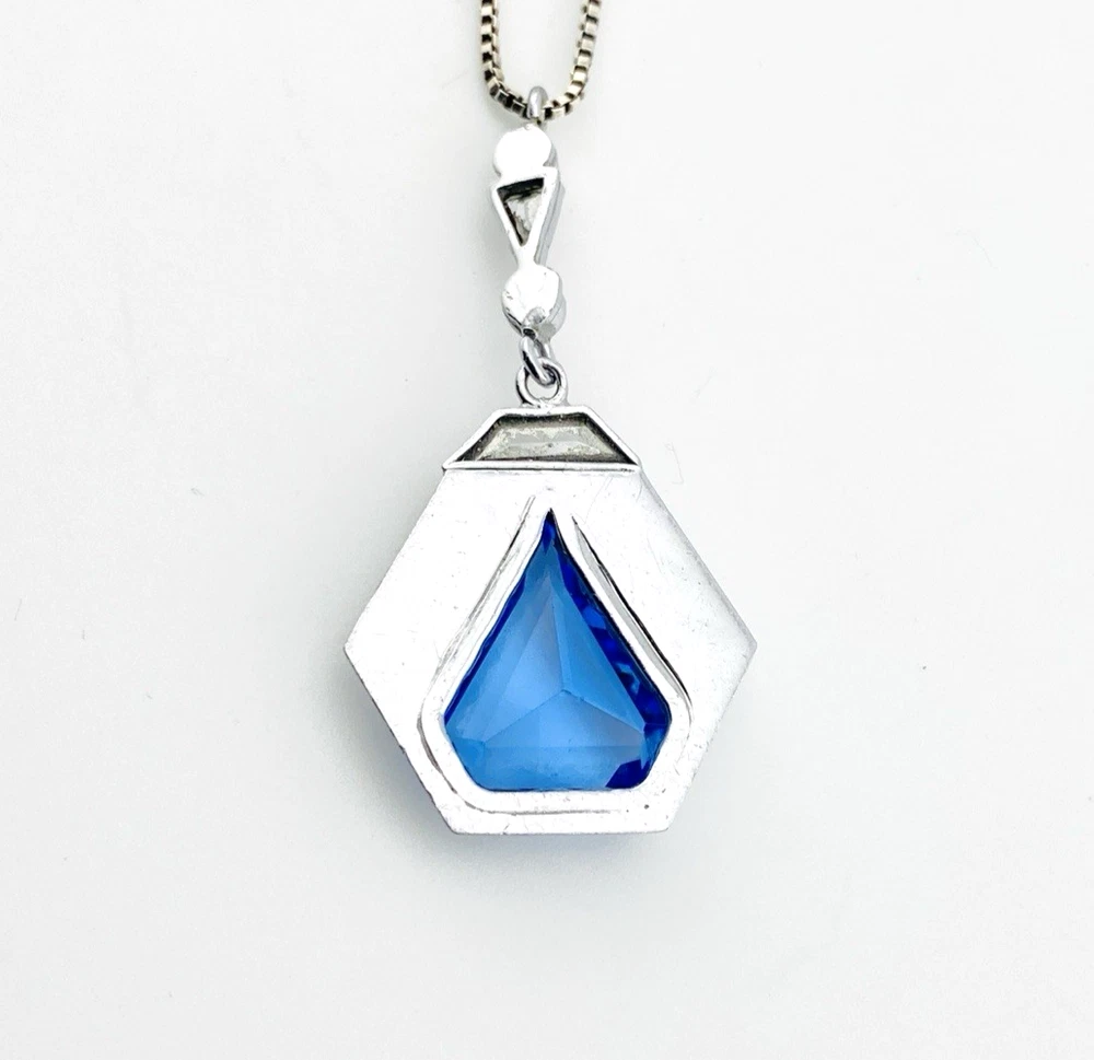 Art Deco shield-form lavalier necklace with cornflower-blue glass and clear paste stones