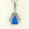 Art Deco shield-form lavalier necklace with cornflower-blue glass and clear paste stones
