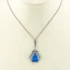 Art Deco shield-form lavalier necklace with cornflower-blue glass and clear paste stones