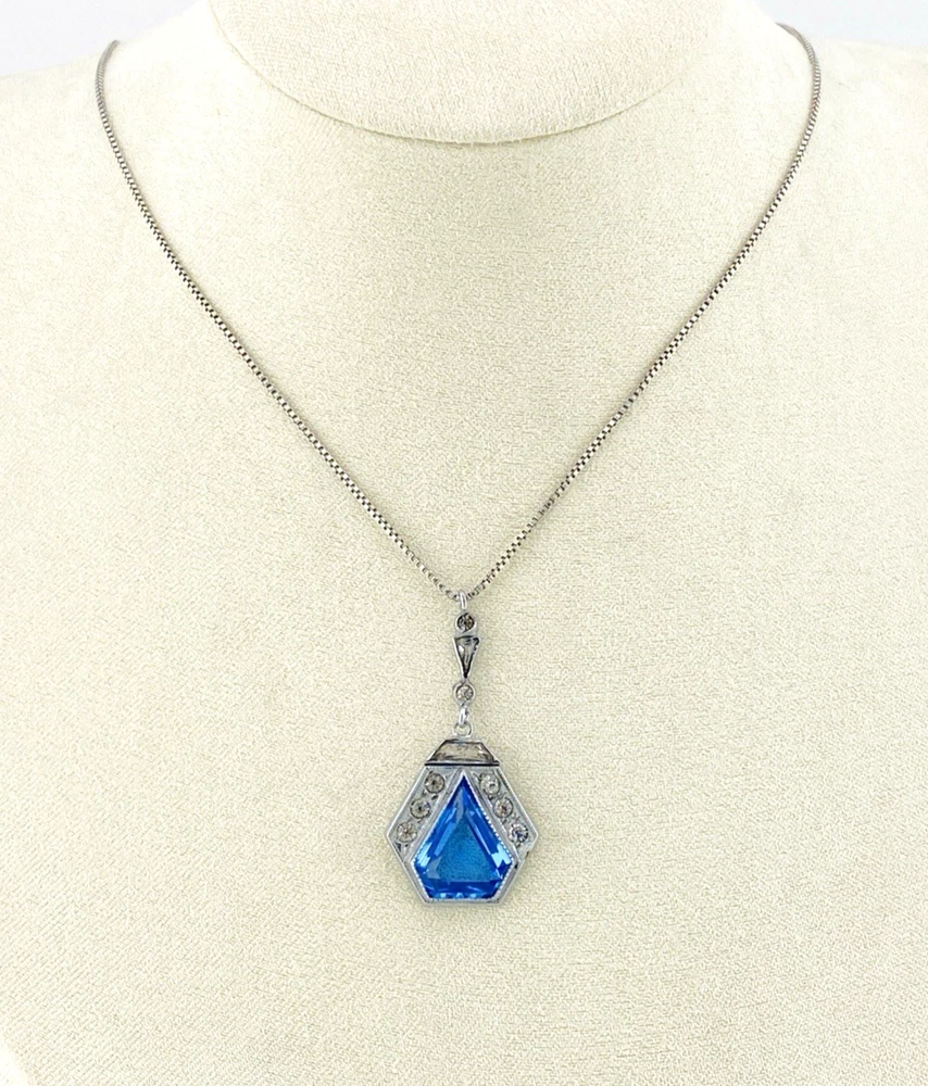 Art Deco shield-form lavalier necklace with cornflower-blue glass and clear paste stones