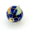 Dimensional blue enamel world globe pendant inlaid with gemstones and shell