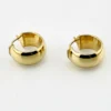 Wide polished 14K yellow gold Italian huggie hoop earrings with hinged posts