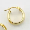Wide polished 14K yellow gold Italian huggie hoop earrings with hinged posts
