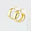Wide polished 14K yellow gold Italian huggie hoop earrings with hinged posts