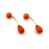 Vintage orange-red coral front-back earrings with curved 14K gold connectors